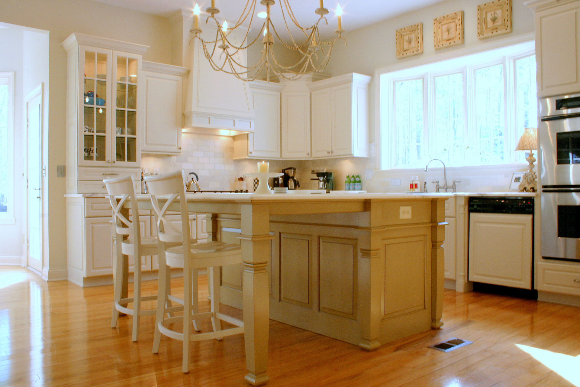 Ivory kitchen with a glazed khaki island, built by Trillium for the Creekside project